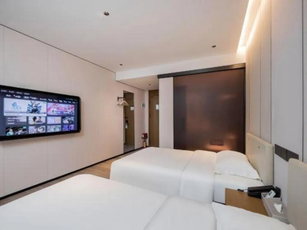 Bed in GreenTree Inn Guangzhou Panyu Bus Station Business Hotel