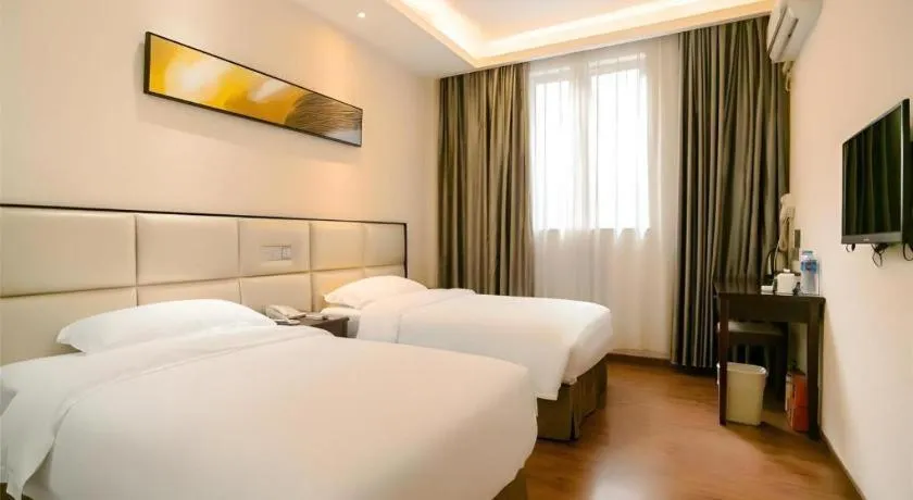 Bed in GreenTree Inn Guangzhou Panyu Bus Station Business Hotel