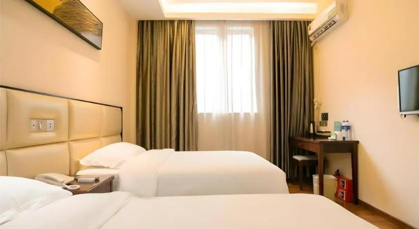 Bed in GreenTree Inn Guangzhou Panyu Bus Station Business Hotel