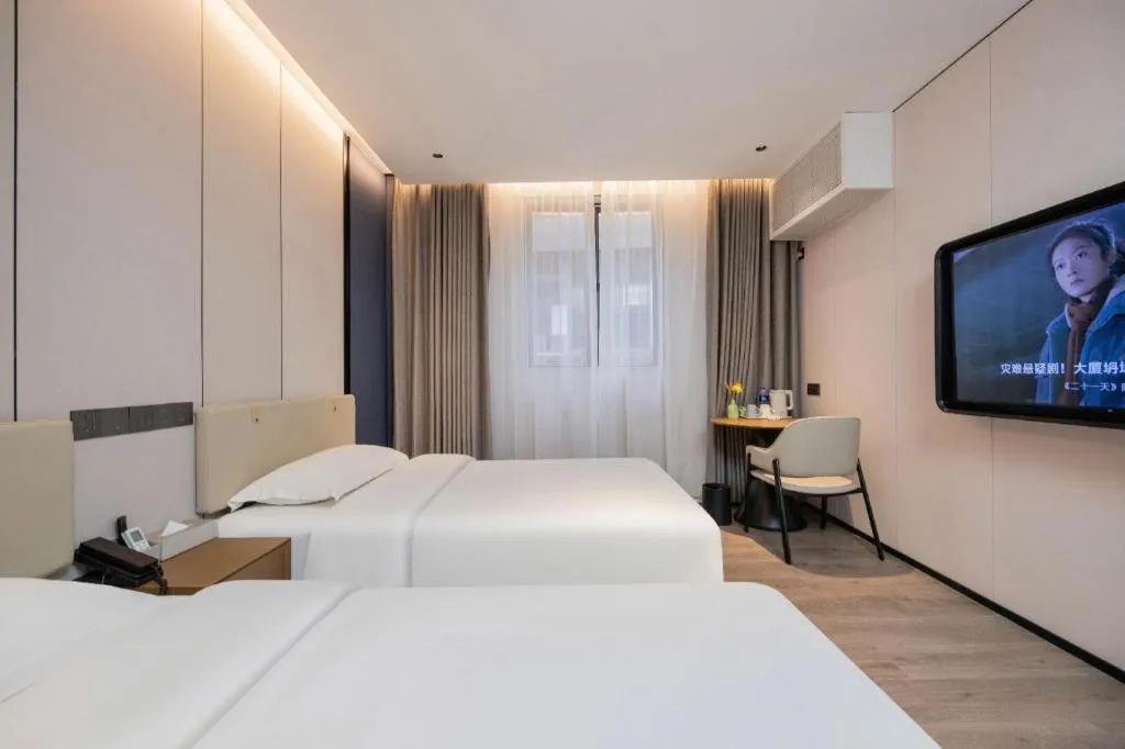 Bed in GreenTree Inn Guangzhou Panyu Bus Station Business Hotel