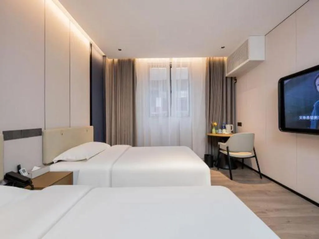 Bed in GreenTree Inn Guangzhou Panyu Bus Station Business Hotel