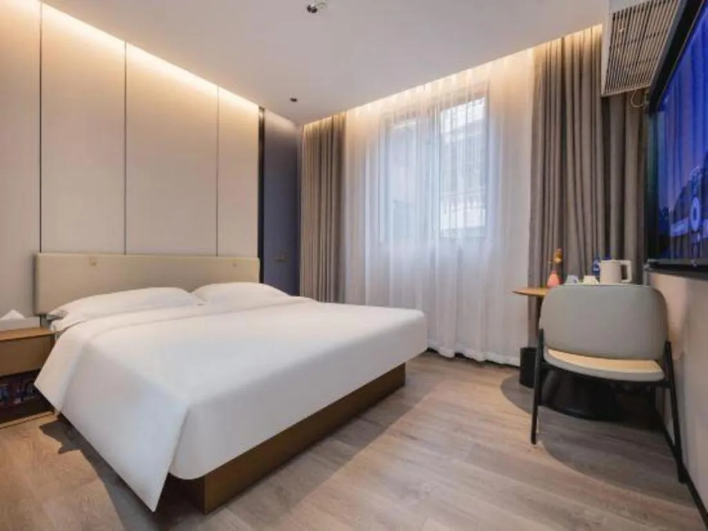 Bed in GreenTree Inn Guangzhou Panyu Bus Station Business Hotel