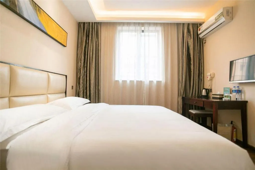 Bed in GreenTree Inn Guangzhou Panyu Bus Station Business Hotel