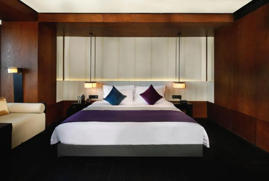 Bed in OCT Bay Breeze Hotel