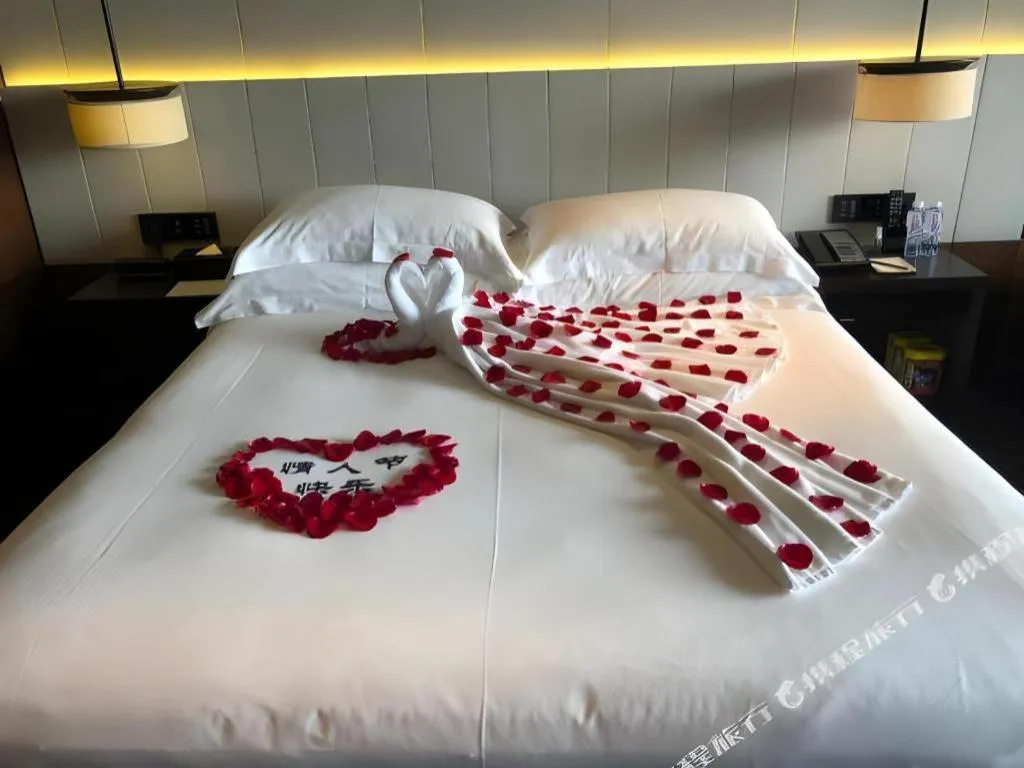 Bed in OCT Bay Breeze Hotel