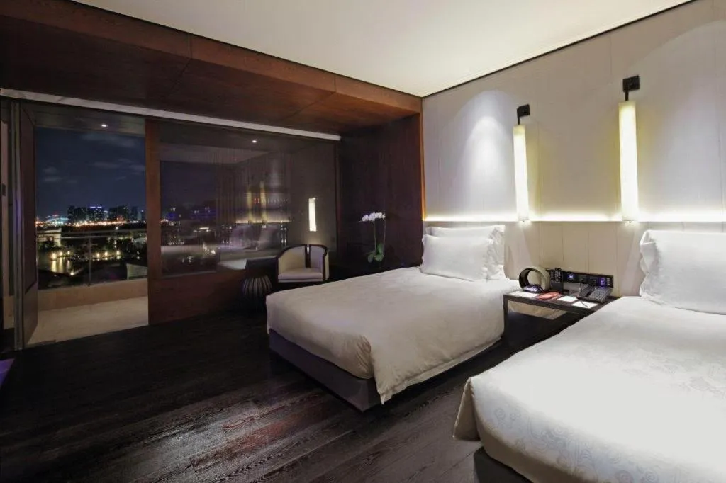 Bed in OCT Bay Breeze Hotel