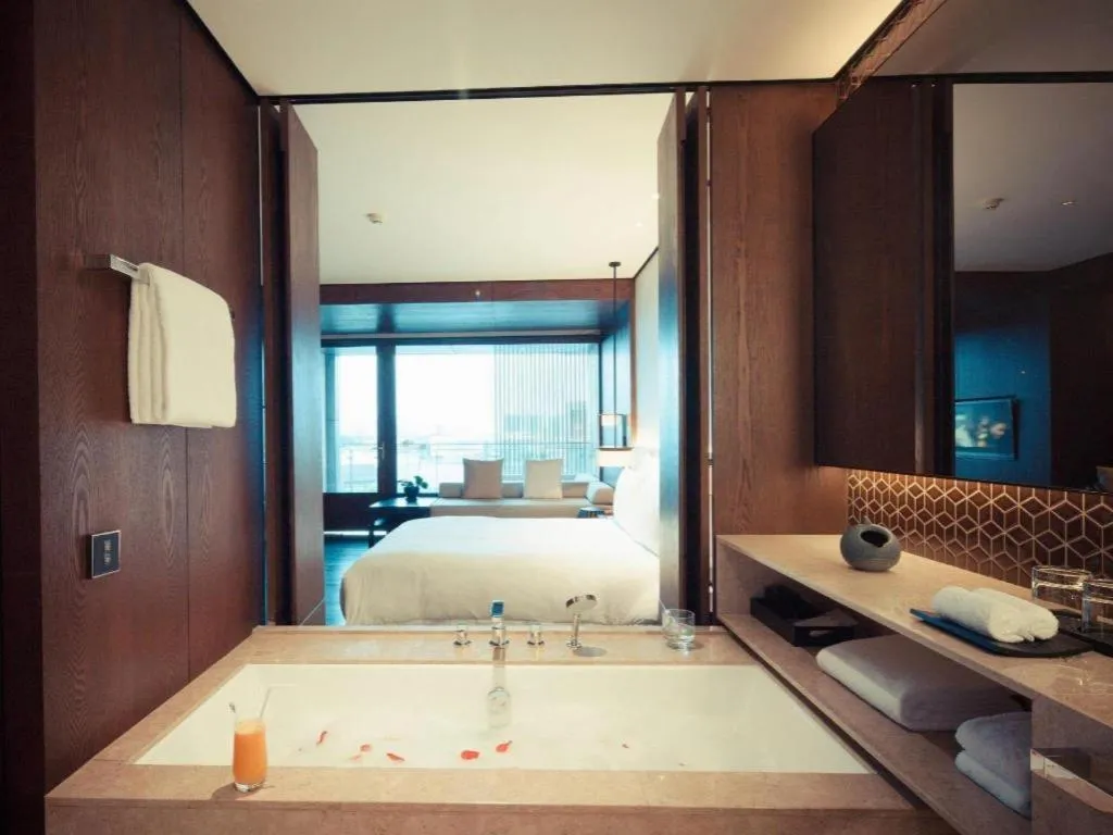 Bed in OCT Bay Breeze Hotel