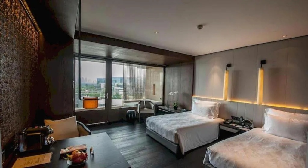 Bed in OCT Bay Breeze Hotel