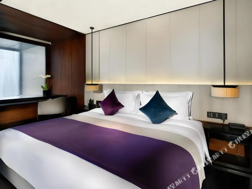 Bed in OCT Bay Breeze Hotel