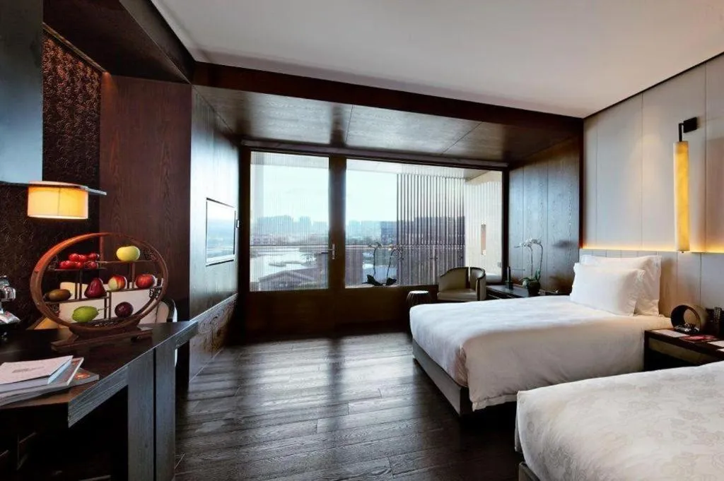 Bed in OCT Bay Breeze Hotel