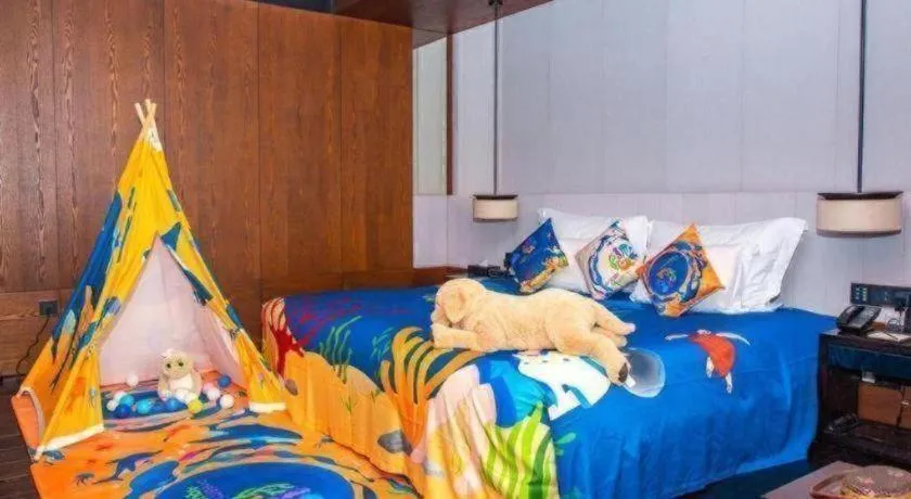 Bed in OCT Bay Breeze Hotel