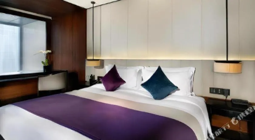 Bed in OCT Bay Breeze Hotel