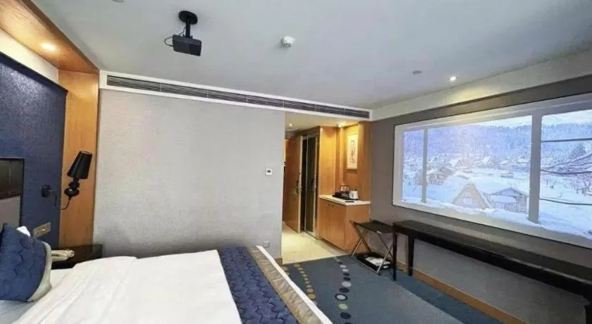 Bed in Grand Skylight Hotel KaiMei