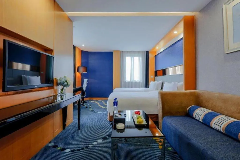 Bed in Grand Skylight Hotel KaiMei