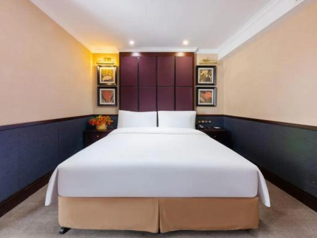 Bed in Grand Skylight Hotel KaiMei