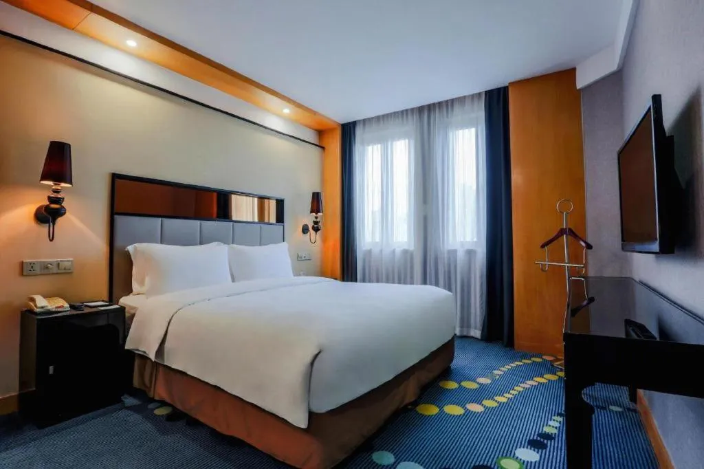 Bed in Grand Skylight Hotel KaiMei