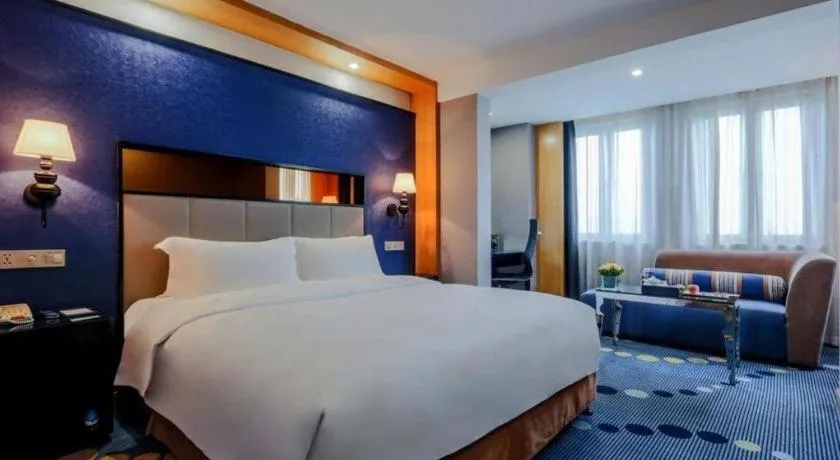 Bed in Grand Skylight Hotel KaiMei