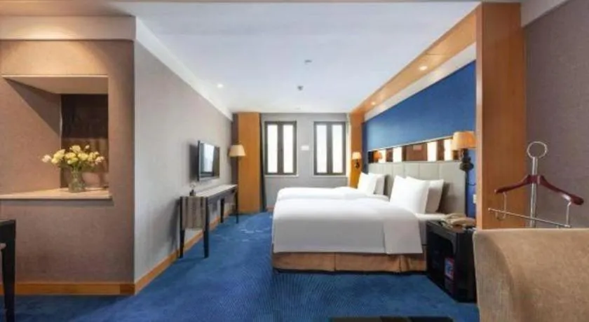 Bed in Grand Skylight Hotel KaiMei