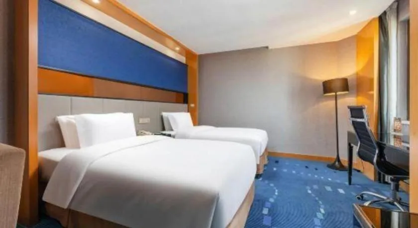 Bed in Grand Skylight Hotel KaiMei