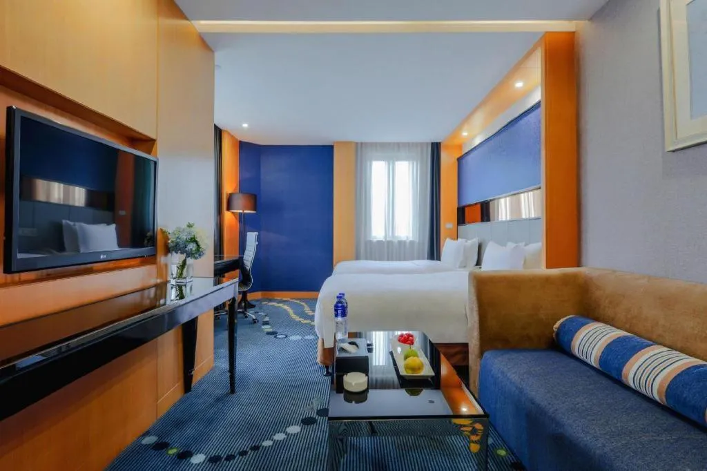 Bed in Grand Skylight Hotel KaiMei