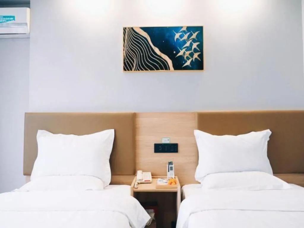 Bed in GreenTree Inn Jiaxing Tongxiang Tudian Express Hotel