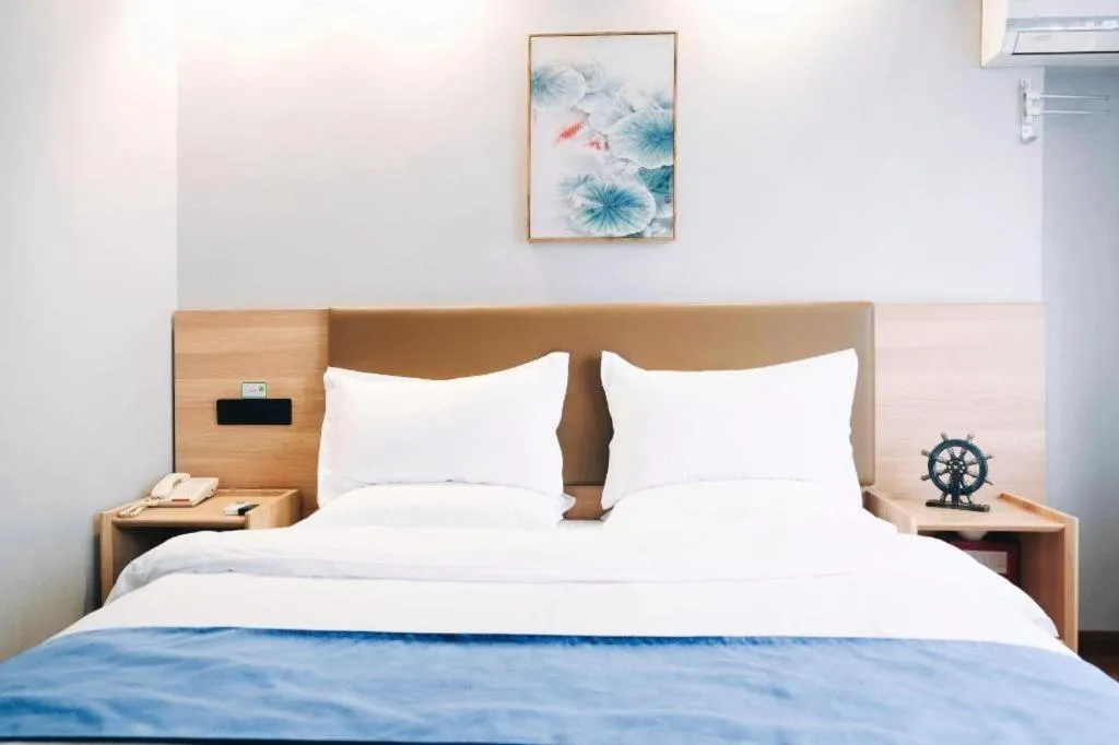 Bed in GreenTree Inn Jiaxing Tongxiang Tudian Express Hotel