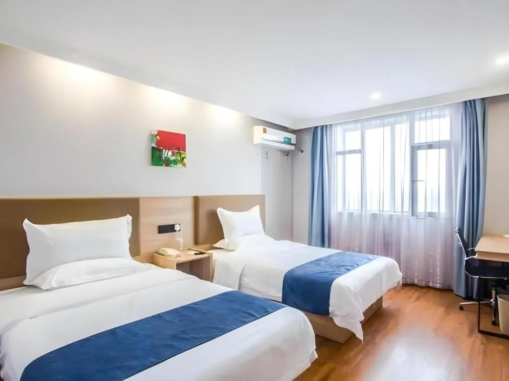 Bed in GreenTree Inn Jiaxing Tongxiang Tudian Express Hotel