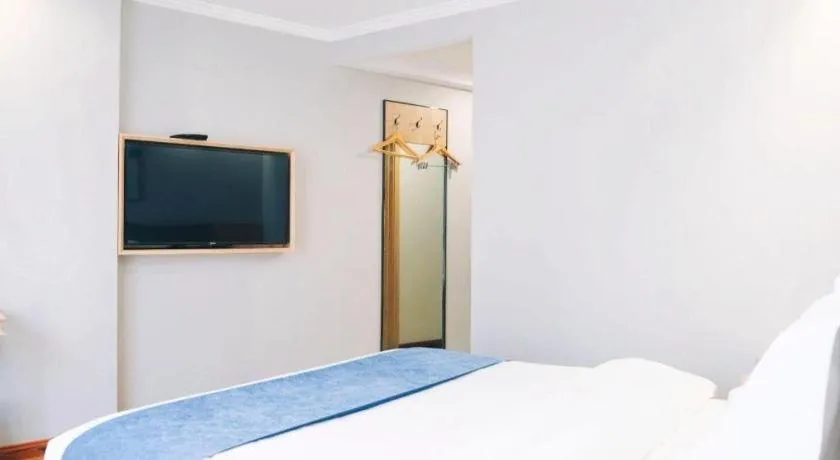 Bed in GreenTree Inn Jiaxing Tongxiang Tudian Express Hotel