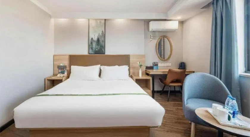 Bed in GreenTree Inn Jiaxing Tongxiang Tudian Express Hotel