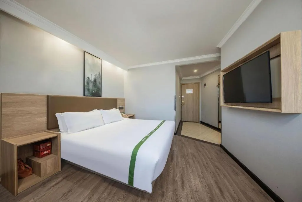 Bed in GreenTree Inn Jiaxing Tongxiang Tudian Express Hotel