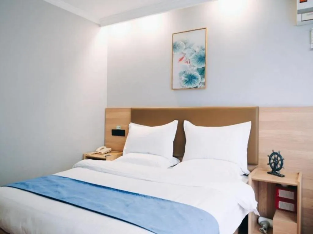 Bed in GreenTree Inn Jiaxing Tongxiang Tudian Express Hotel