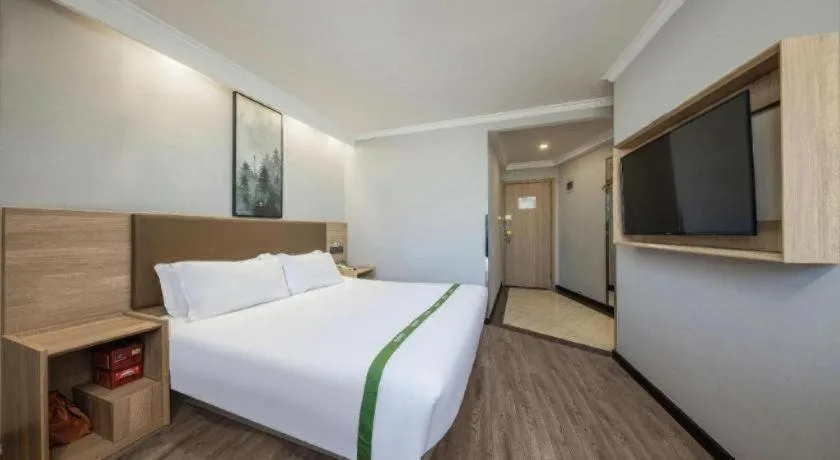 Bed in GreenTree Inn Jiaxing Tongxiang Tudian Express Hotel