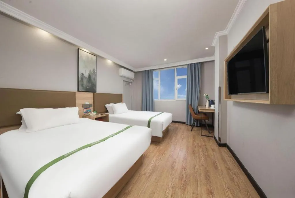 Bed in GreenTree Inn Jiaxing Tongxiang Tudian Express Hotel