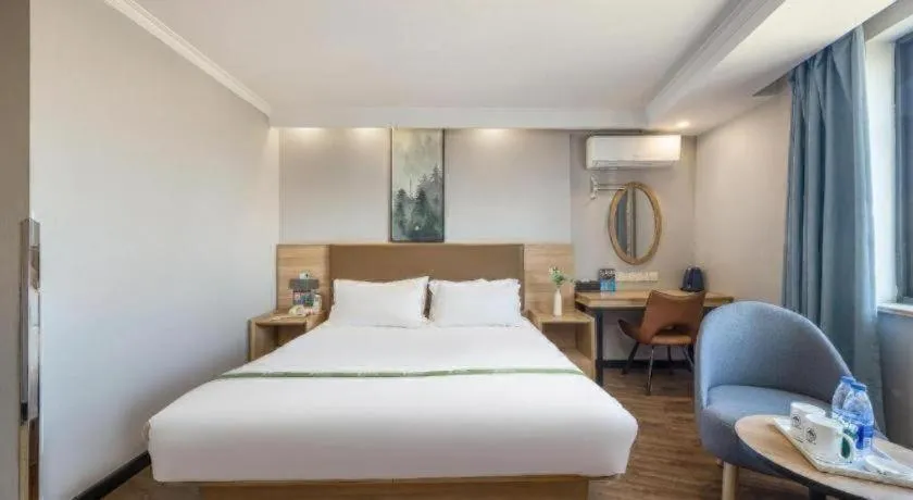 Bed in GreenTree Inn Jiaxing Tongxiang Tudian Express Hotel