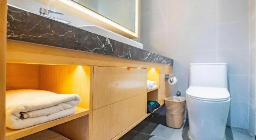 Bed in GreenTree Inn Lianyungang Suning Square Hualian Mantion Hotel