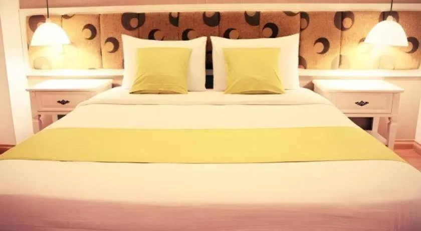 Bed in Golden Ant Hotels
