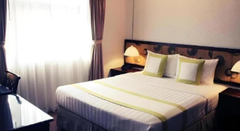 Bed in Golden Ant Hotels