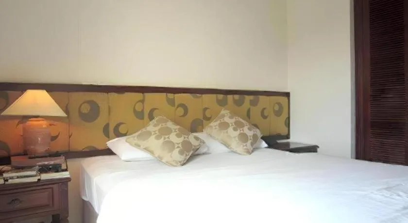 Bed in Golden Ant Hotels