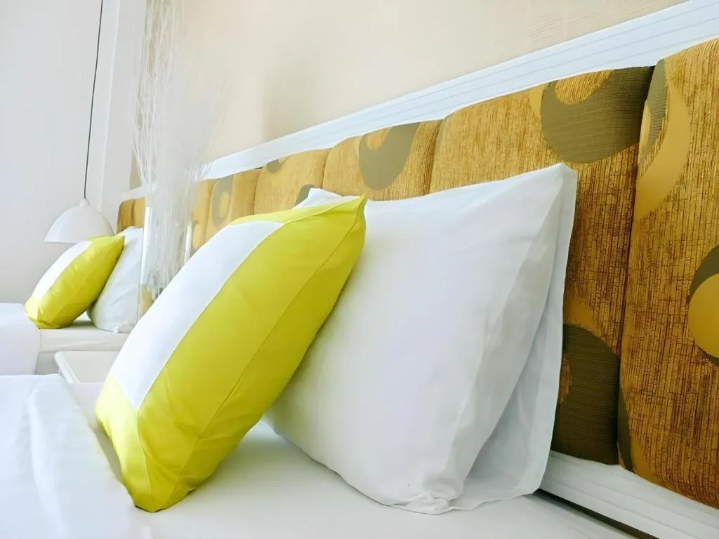 Bed in Golden Ant Hotels