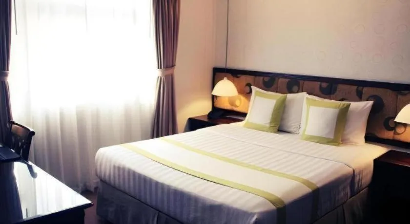 Bed in Golden Ant Hotels