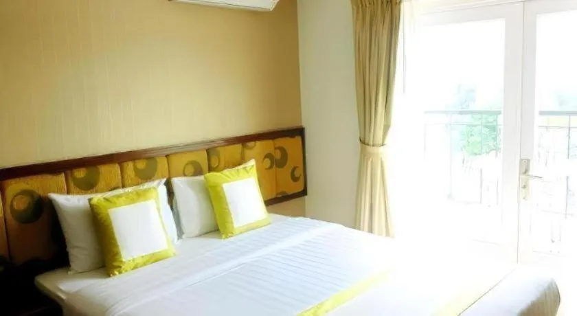 Bed in Golden Ant Hotels