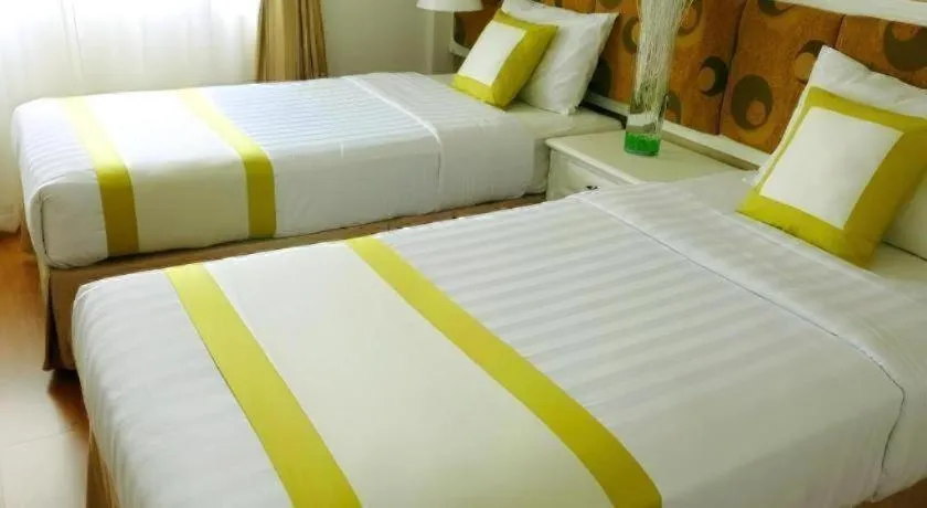 Bed in Golden Ant Hotels