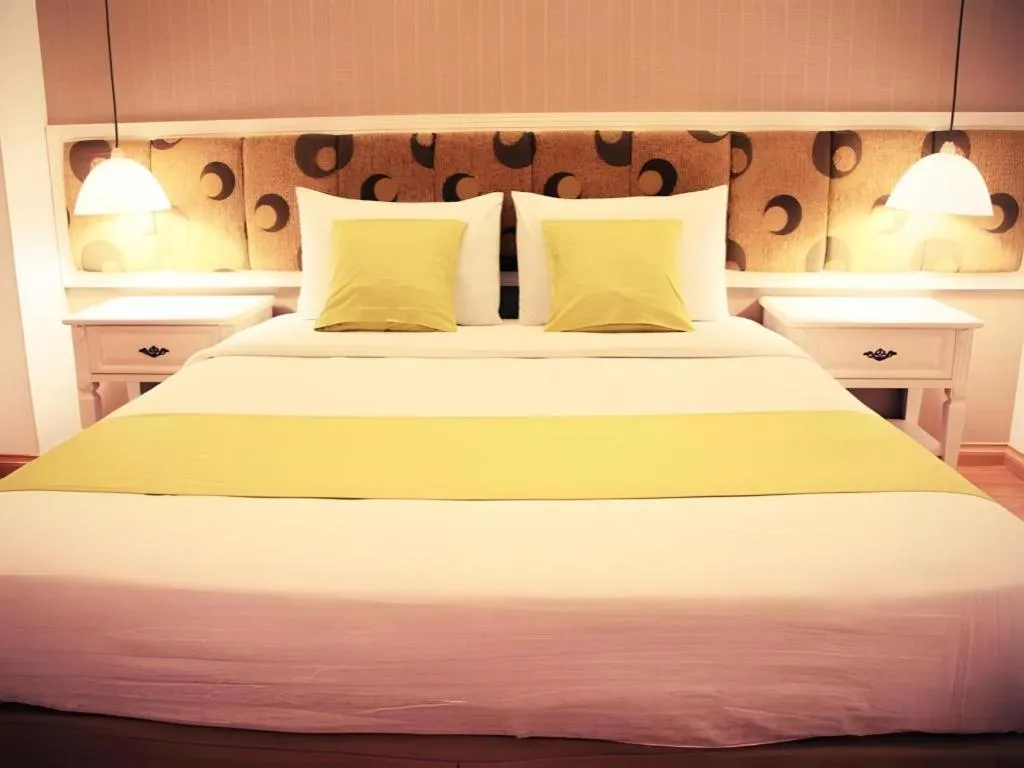 Bed in Golden Ant Hotels