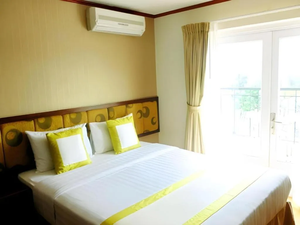 Bed in Golden Ant Hotels