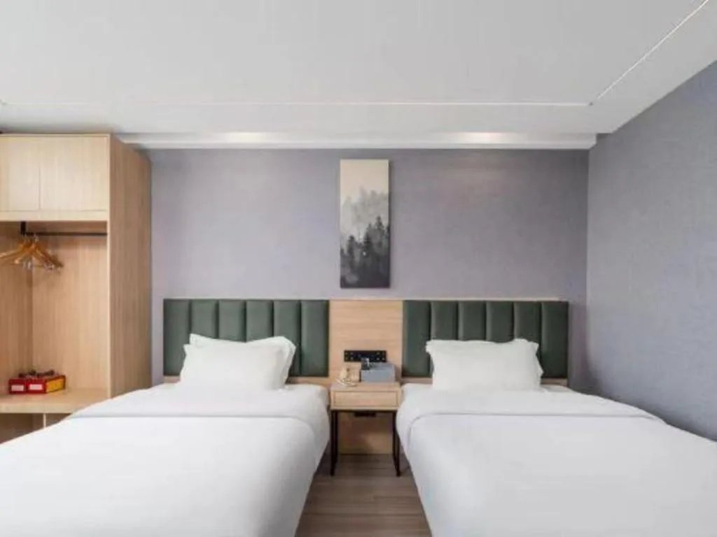 Bed in GreenTree Inn Taizhou Gaogang District Business Hotel