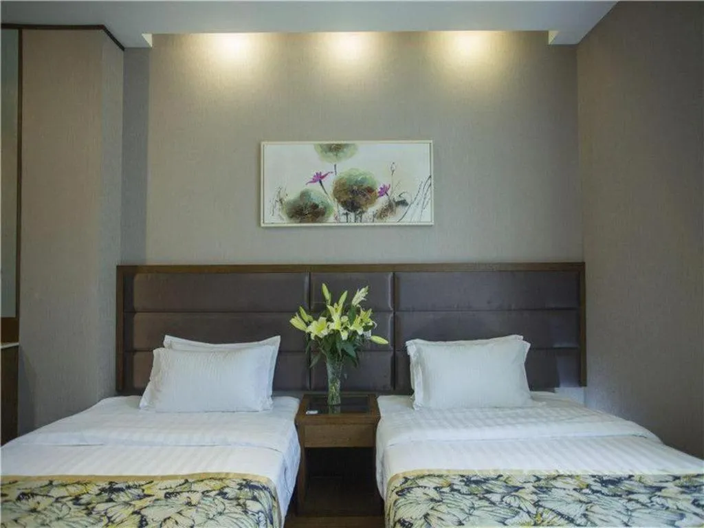 Bed in GreenTree Inn Taizhou Gaogang District Business Hotel