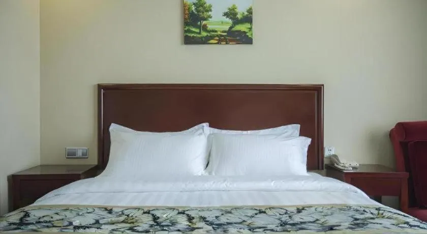 Bed in GreenTree Inn Taizhou Gaogang District Business Hotel