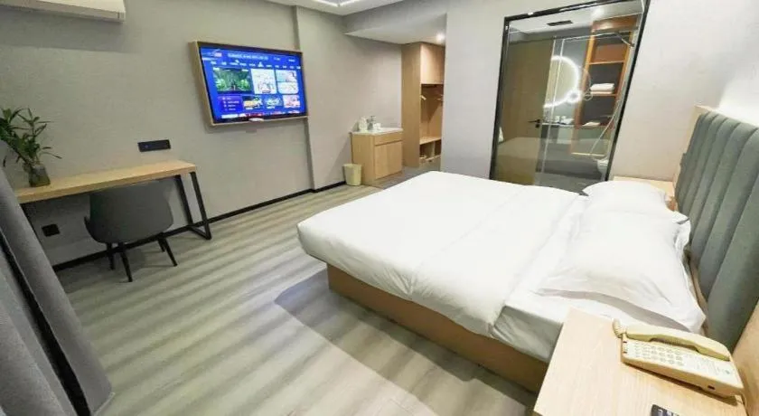 Bed in GreenTree Inn Taizhou Gaogang District Business Hotel