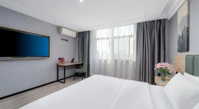 Bed in GreenTree Inn Taizhou Gaogang District Business Hotel
