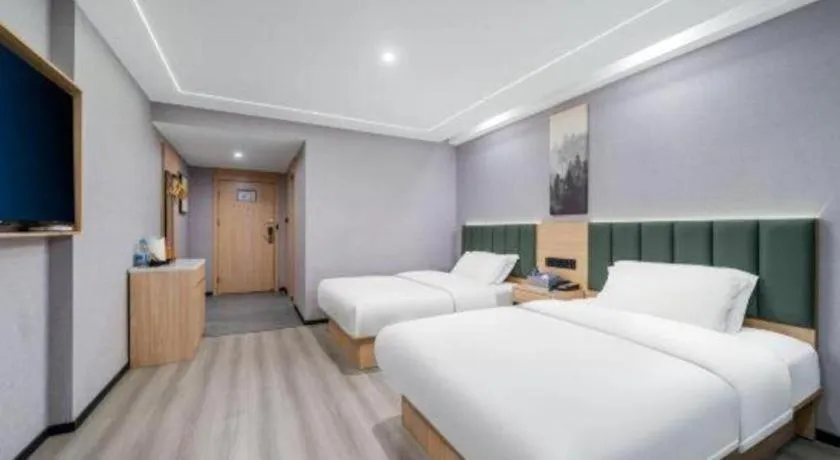 Bed in GreenTree Inn Taizhou Gaogang District Business Hotel